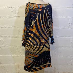 Symphony Asymmetrical Multi Colored Long Sleeve Dress in Mod Print that drapes